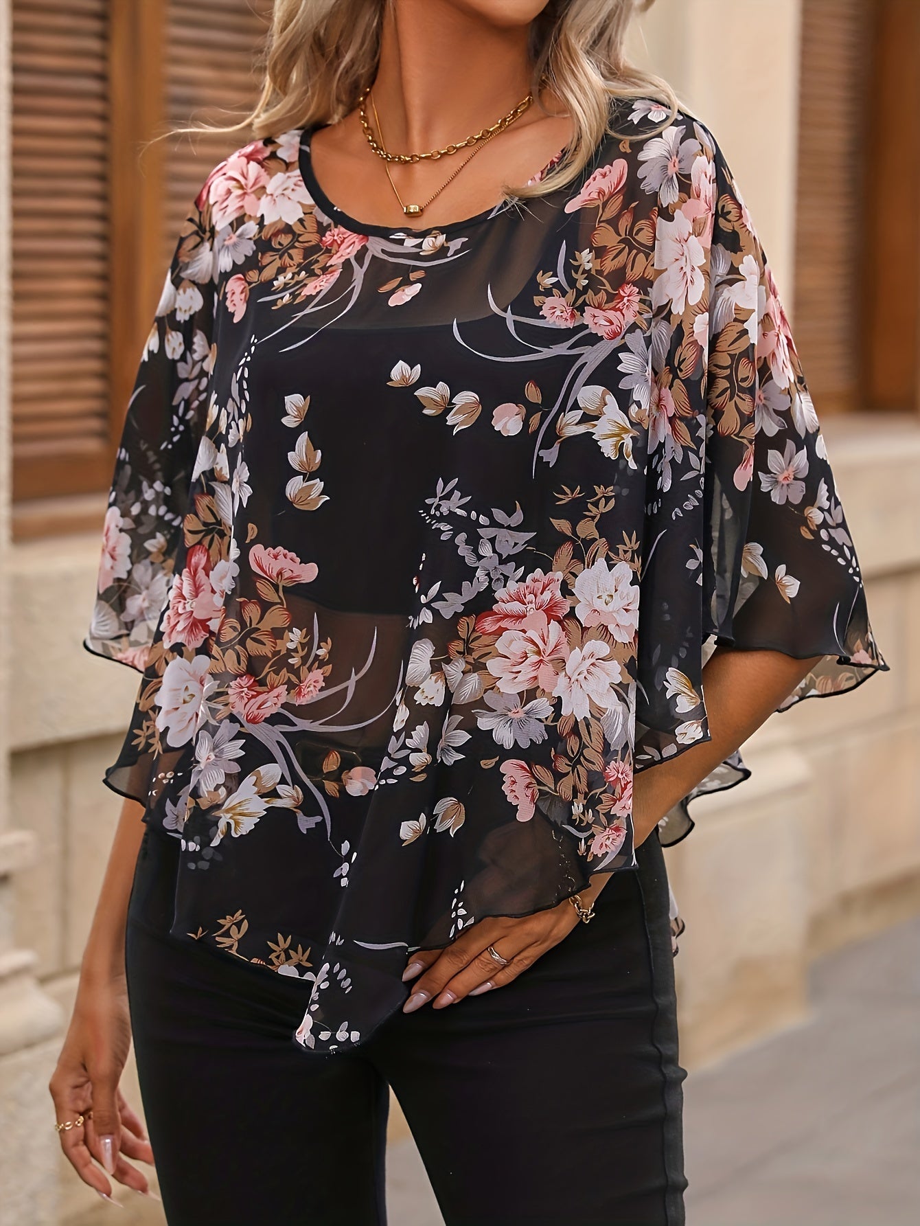 Schwarze Bluse mit Blumenprint und asymmetrischem Design - Noor